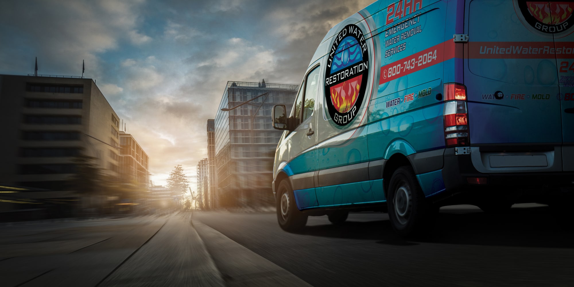 A United Water Restoration Group of Downriver van heading out on an emergency call at sunset